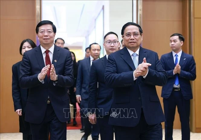 Le Premier ministre Pham Minh Chinh et Qiu Yong, secrétaire du Comité du PCC de l’Université Tsinghua. Photo: VNA